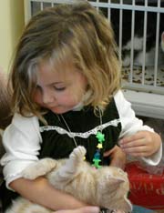 little girl with adopted kitten